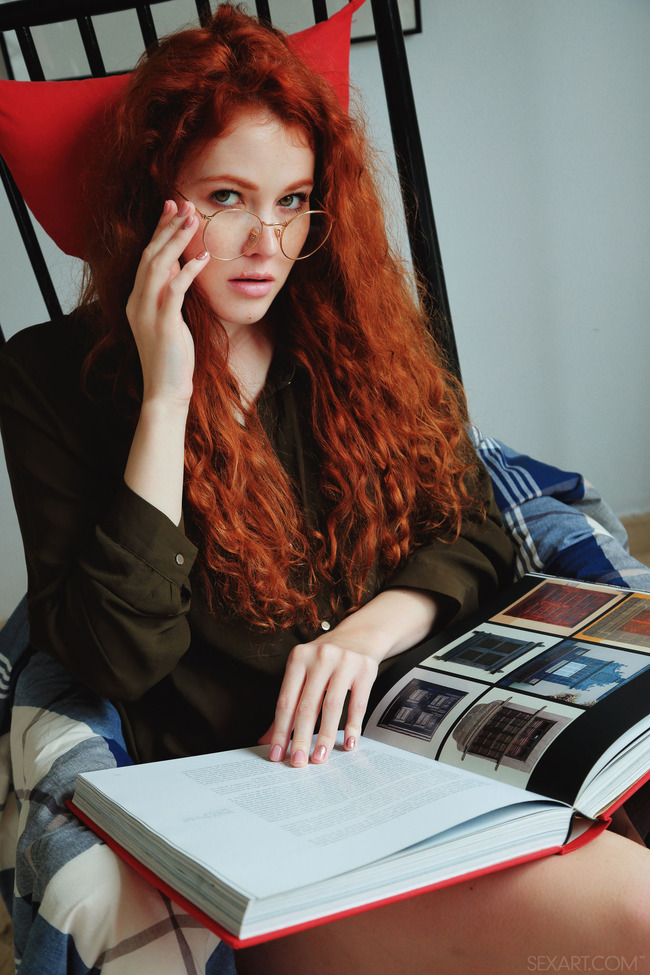 Studious redhead Adel C looks sexy in her gold rimmed glasses (3/21)
